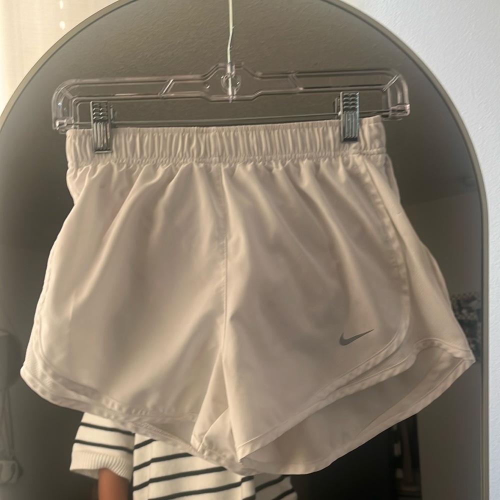 White Nike running shorts
